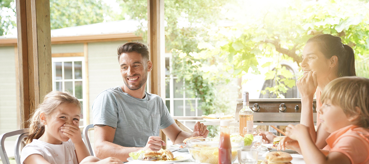 Image of holiday guests eating at lodge