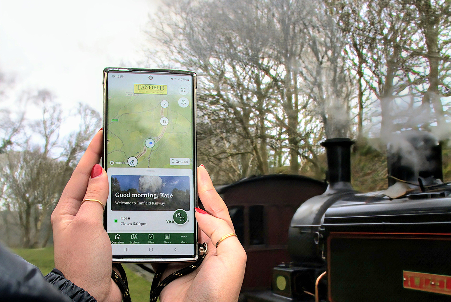 Person holding mobile app at Tanfield Railway