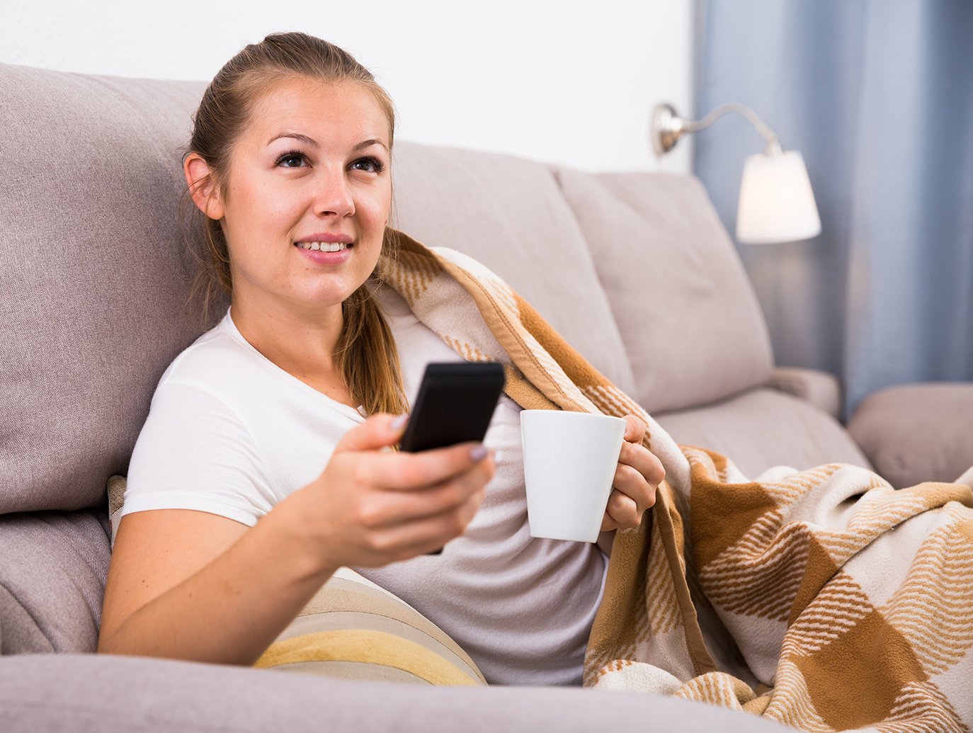 Girl looking on mobile at home