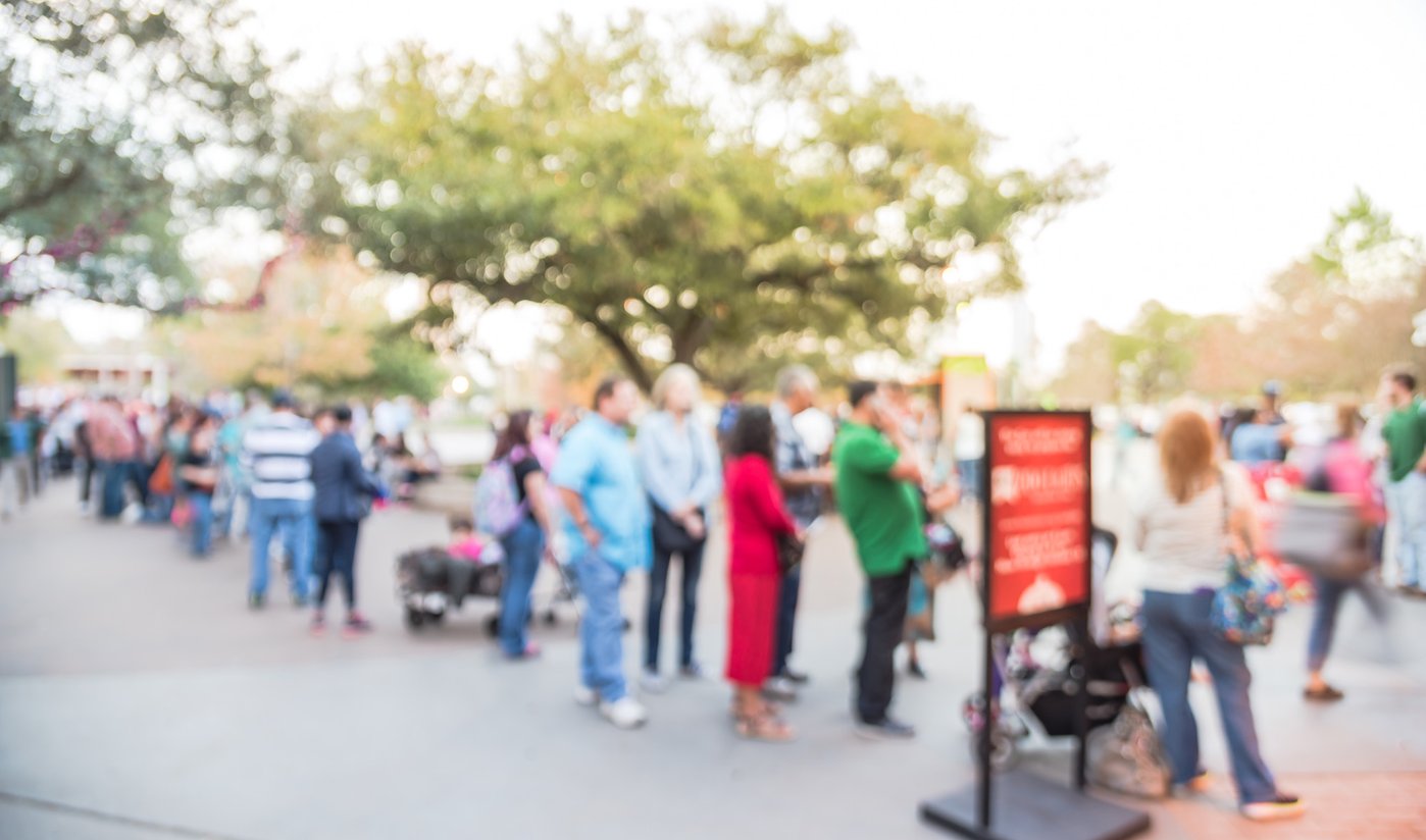 Attraction visitors in a queue