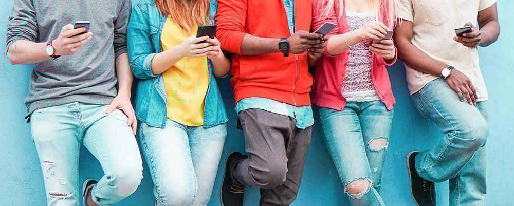 People looking at mobile phones